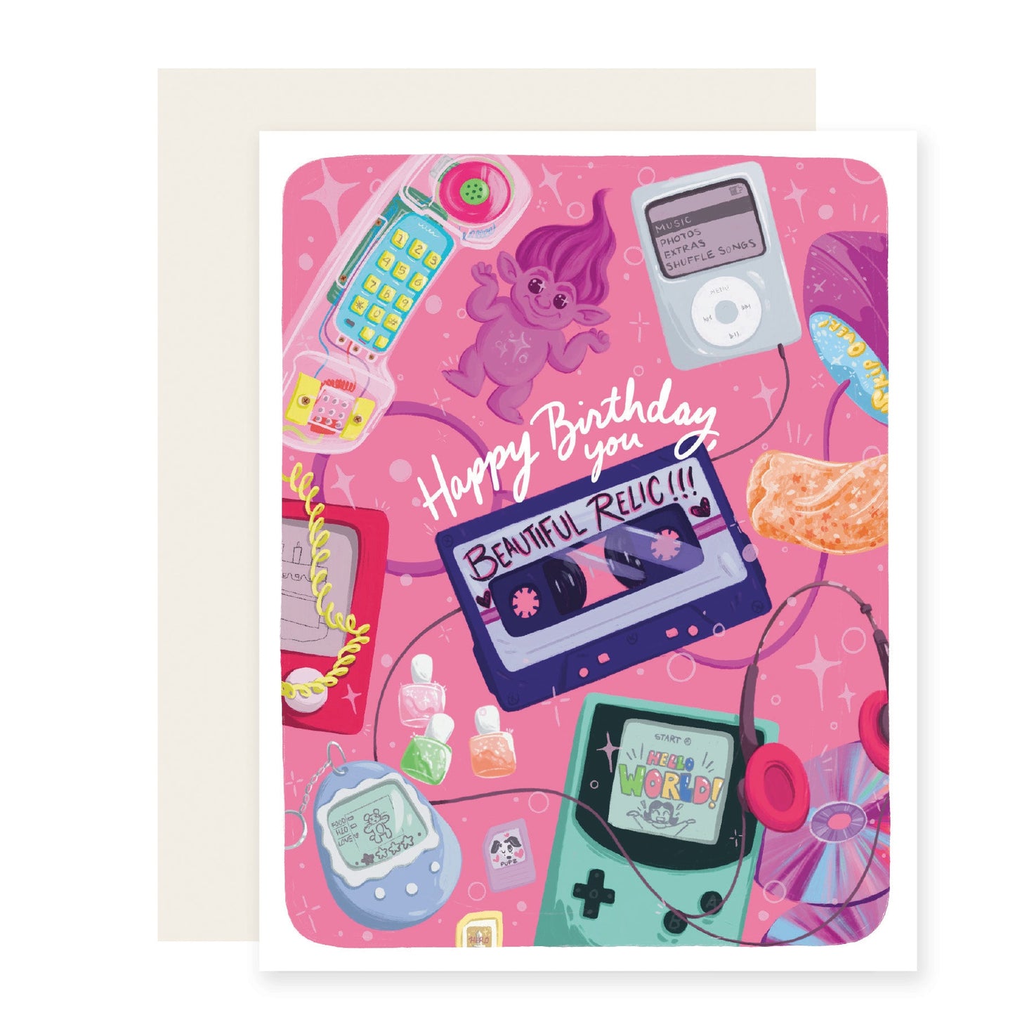 A playful pink birthday card featuring a delightful mix of nostalgic 90s elements, including troll dolls, Gameboys, CDs, cassette tapes, and more. The card reads, 'Happy Birthday, you beautiful relic,' celebrating the charm of the past .