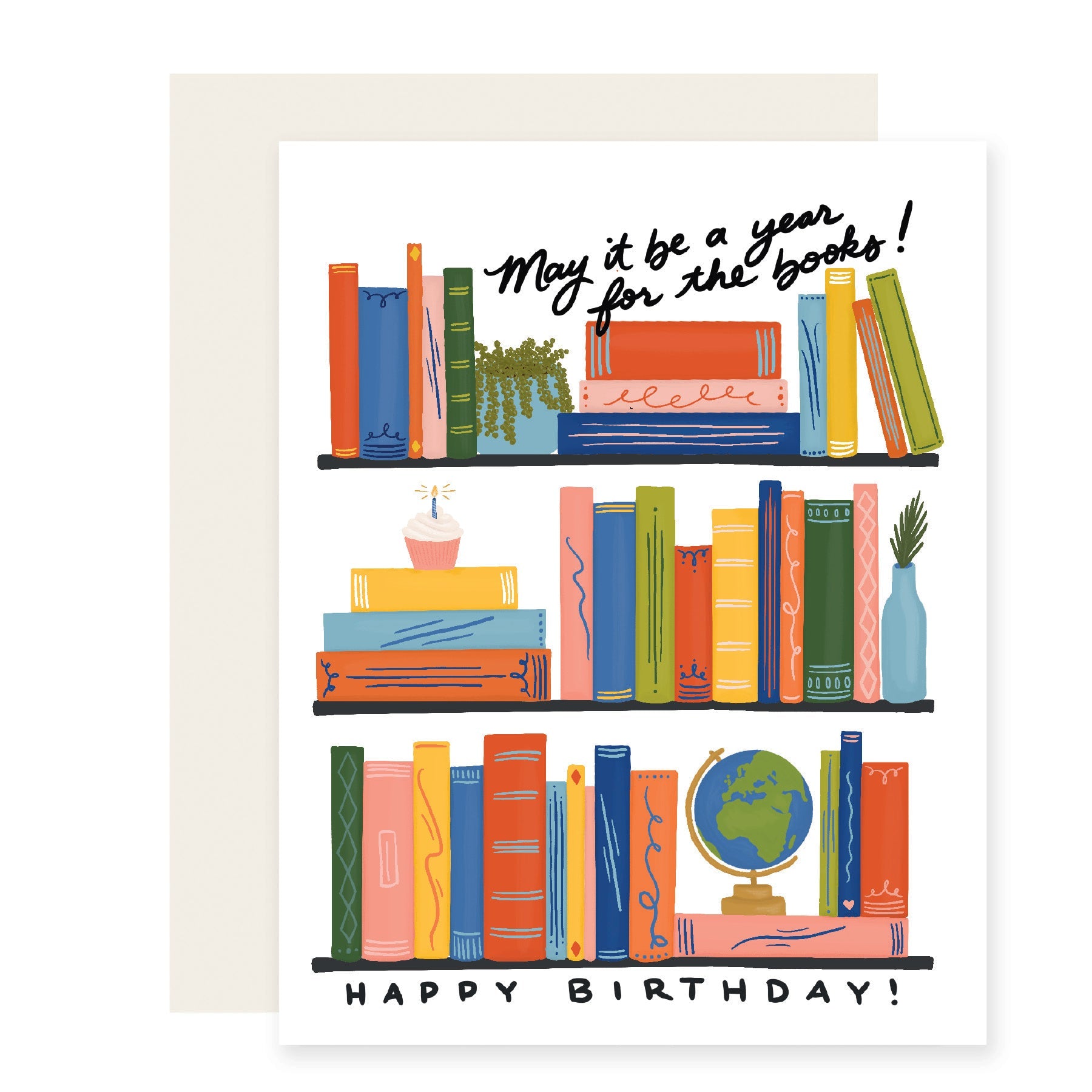 A delightful birthday card featuring beautifully illustrated bookshelves adorned with colorful books. Among the shelves, a special touch includes a birthday cake, a globe, and a house plant – a perfect celebration for the avid book lover. The card reads, 'May it be a year for the books. Happy Birthday! 