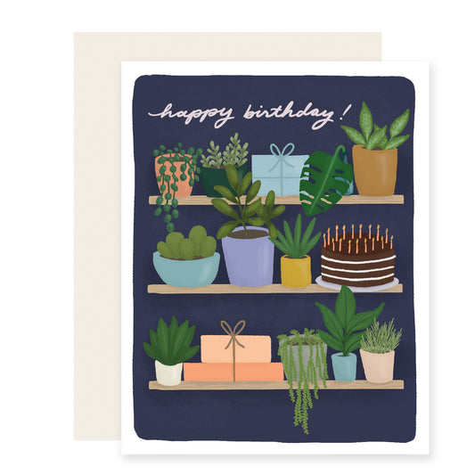Illustrated birthday card with shelves of house plants, saying 'Happy Birthday,' ideal for plant lovers.
