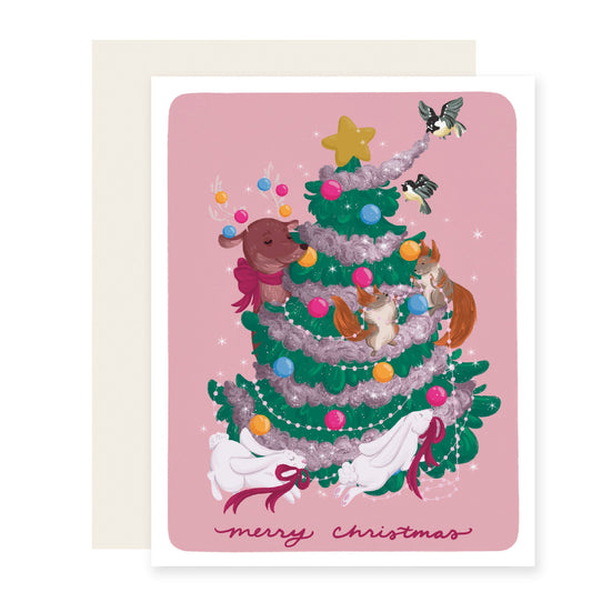  A beautifully illustrated Christmas card featuring vibrant woodland creatures playfully decorating a Christmas tree, with the text 'Merry Christmas'.