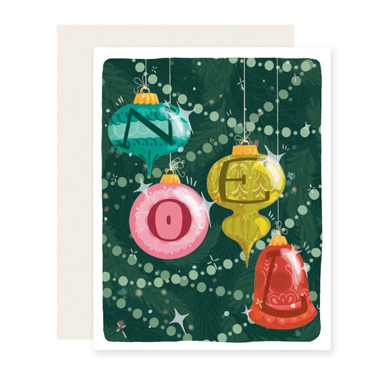 A vibrant Christmas card featuring a decorated tree adorned with classic ornaments. Each ornament bears a letter, spelling out the word 'NOEL'.