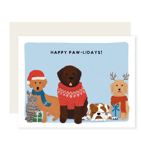 A charmingly illustrated Christmas card featuring adorable dogs wearing scarves and hats on the front. The text reads 'Happy Paw-lidays', making it perfect for dog lovers.