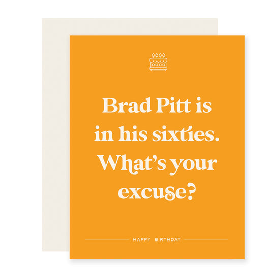 Funny birthday card that reads 'Brad Pitt is in his sixties. What's your excuse?' Card is yellow.