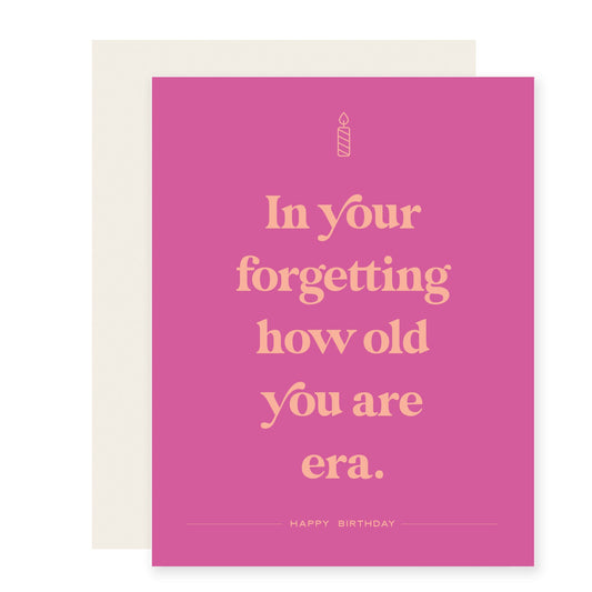 Pink card featuring salmon colored text with a humorous birthday message: In your forgetting how old you are era.  Happy Birthday!'