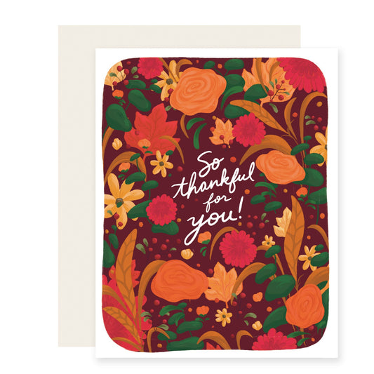 A vibrant fall-themed thank you card adorned with colorful autumn florals. The card reads 'So thankful for you'.