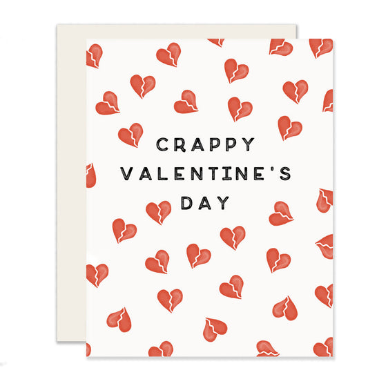 Humorous Valentine's Day card with the words 'Crappy Valentine's Day' and delicately illustrated broken hearts on the front, adding a touch of playful sarcasm to the occasion.