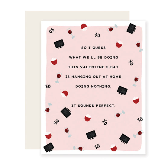 A Valentine's Day card featuring cute illustrations of wine glasses, TVs, and popcorn bowls. It Reads:  'Guess what we'll be doing this Valentine's Day is hanging out at home doing nothing. Sounds perfect.' The whimsical design adds sweetness to the laid-back sentiment.