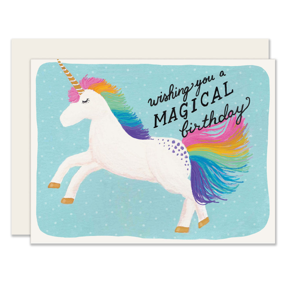 A colorful birthday card featuring an adorably illustrated unicorn with a rainbow tail. The card reads 'Wishing you a magical birthday,' exuding whimsy and enchantment.