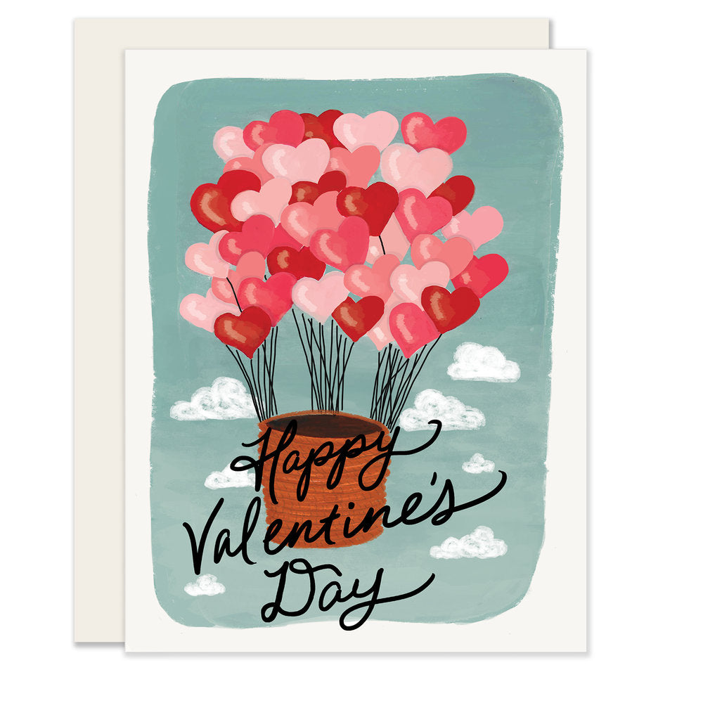 A beautifully illustrated Valentine's Day card featuring a hot air balloon lifted by numerous small pink heart balloons. The card reads 'Happy Valentine's Day,' adding a whimsical touch to the celebration of love.